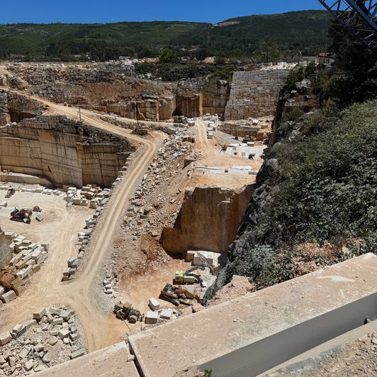 Quarry face with overhead crane